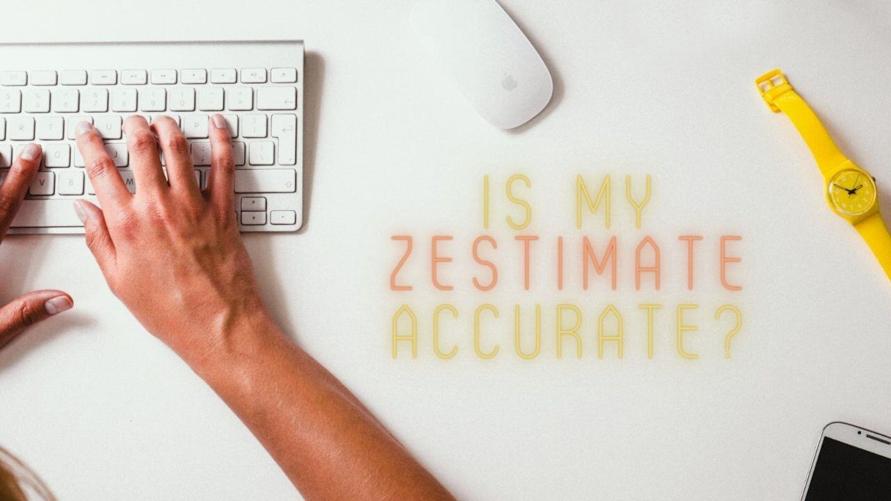 Stylish kitchen with white marble island, barstools, and pendant lighting.